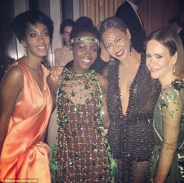 Party gals: Solange looked happy as she posed with her sister, Lupita Nyong