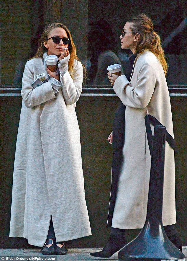 Sister smoke break: In her first sighting since the wedding, Mary-Kate Olsen (L) was spotted smoking a Marlboro Light alongside fraternal twin sister Ashley in Manhattan on Tuesday