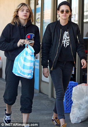Retail fun: Chloe wore a Champion sports hoodie and sneakers in coordinating colors