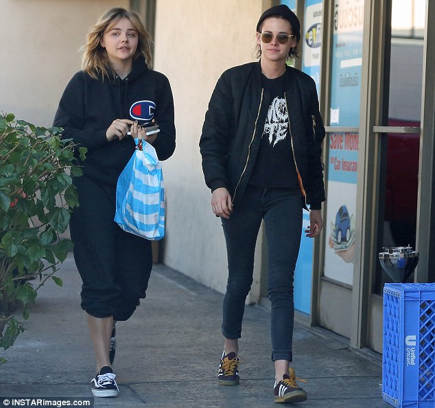 Pals: The 26-year-old Twlight star kept it casual, wearing black skinny jeans with a graphic T-shirt and a bomber jacket