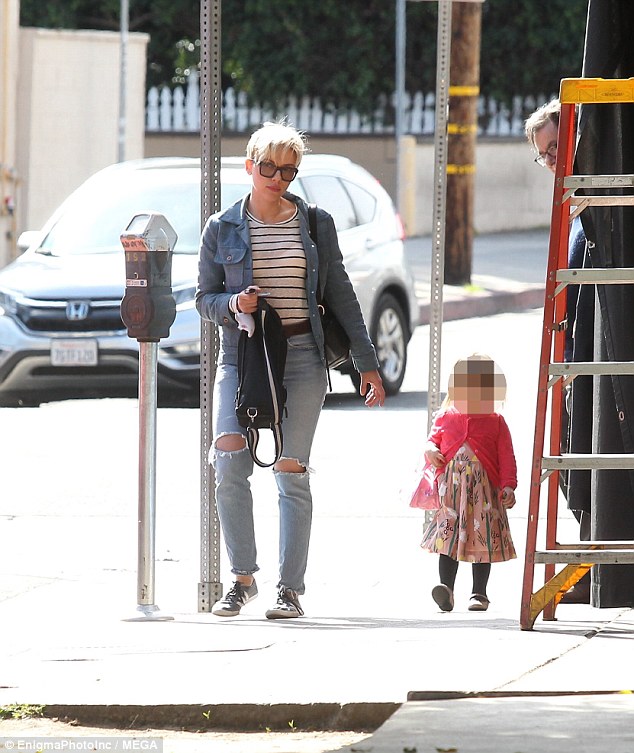 Doting mother: Scarlett Johansson wore a striped T-shirt and ripped jeans as she took her beautiful daughter Rose to lunch in LA on Thursday