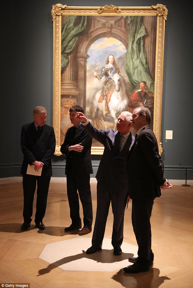 The royal chats to curator Desmond Shawe-Taylor in front of a portrait of Charles I