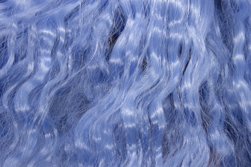 Metallic Blue wavy synthetic hair background. This is a photograph of Metallic Blue wavy synthetic hair background stock photos