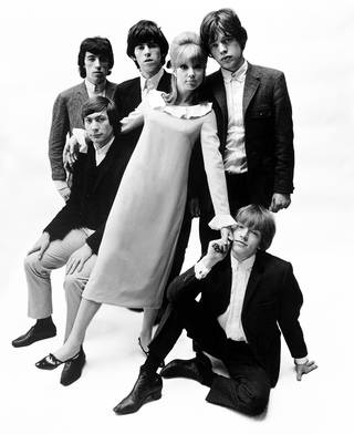 Crêpe dress with frilled collar and cuffs by Mary Quant for Ginger Group, modelled by Patti Boyd with the Rolling Stones. Photograph by John French, 1960s, London. Museum no. CT64253. © Victoria and Albert Museum, London