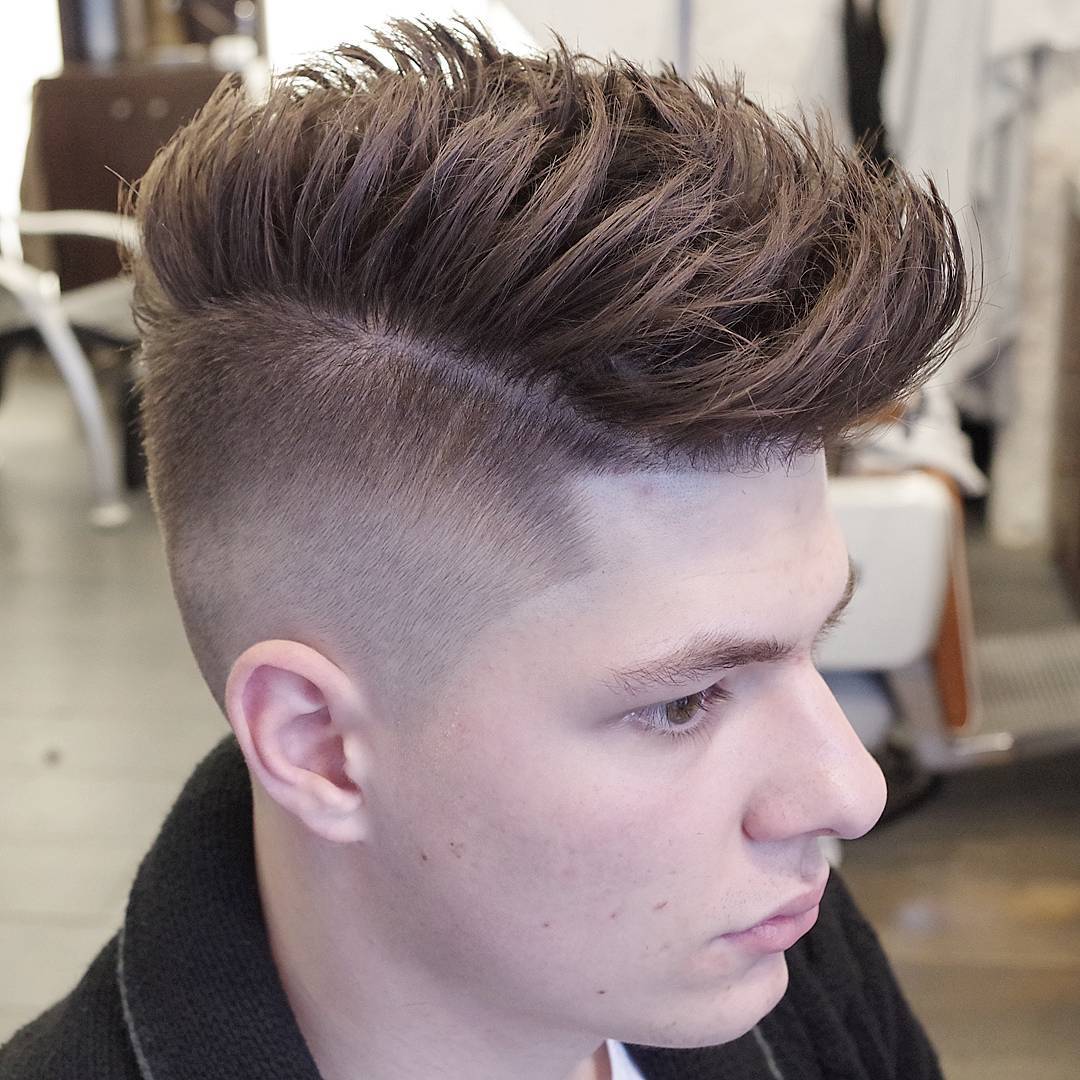 high fade haircut with long spiky textures