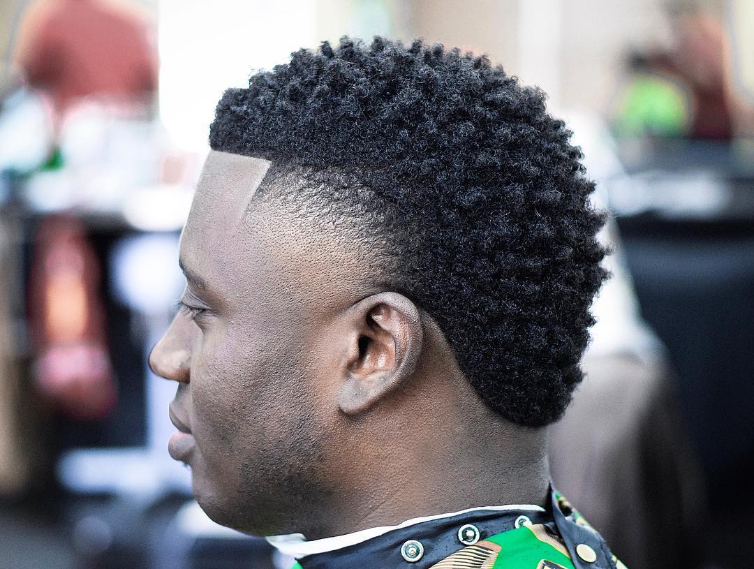 Cool frohawk haircut with temple fade