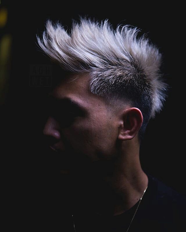Mohawk haircut with a temple fade