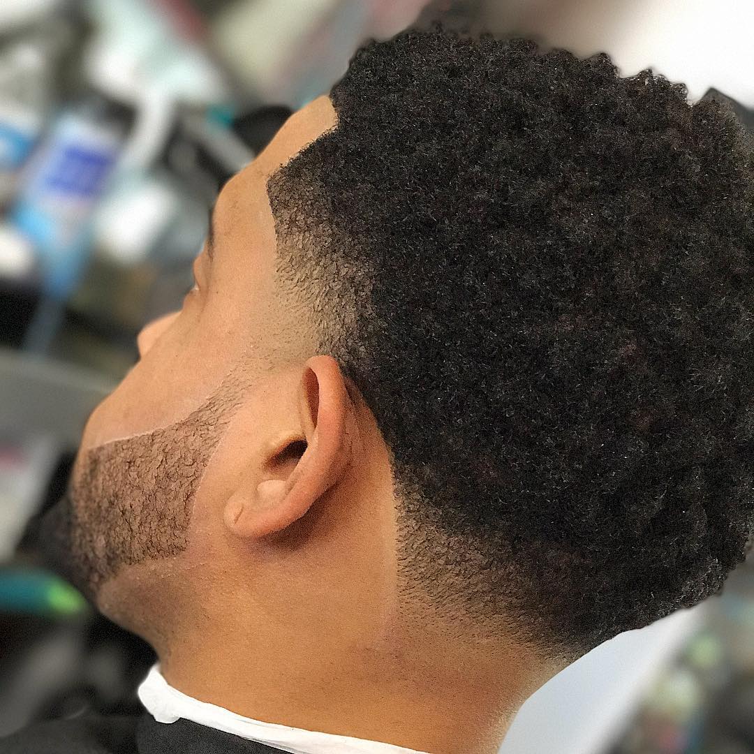 Temple fade and natural curls for black men